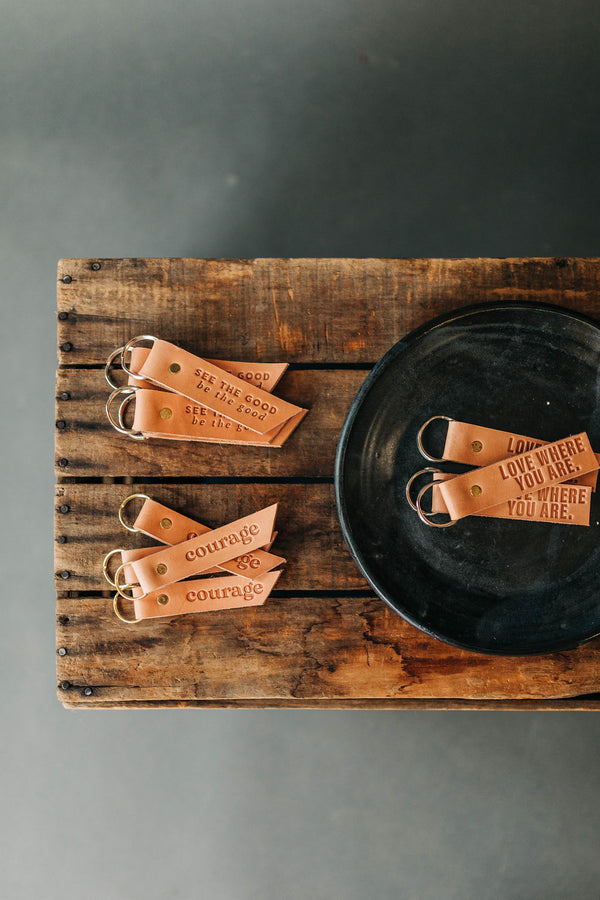 the design: courage. the material: leather.hand stamped by lost penguin leather, made in texas. key fobs are fun but leather key fobs are the most fun. Ramble & Co. is a family owned business. Shop at shop.rambleandcompany.com or visit our store in Wichita Falls, Texas || small batch/ hand printed tees + fine art prints | your source of encouragement + inspiration.