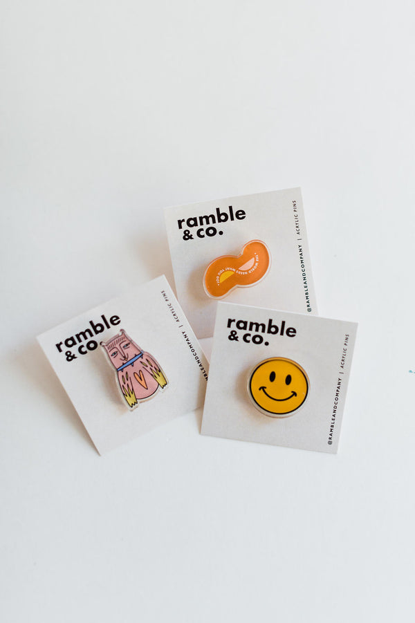 the design: the world needs what you got approx. 1.25 x 0.75 inches acrylic material  attach this button to a jacket, backpack, or wherever you go!     Ramble & Co. is a family owned business. Shop at shop.rambleandcompany.com or visit our store in Wichita Falls, Texas || small batch/ hand printed tees + fine art prints | your source of encouragement + inspiration.