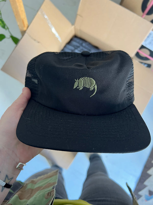 embroidered armadillo | black nylon field trip trucker hat