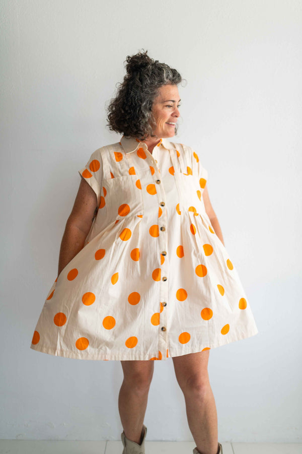 polka dot pleated poplin mini dress | cream + orange