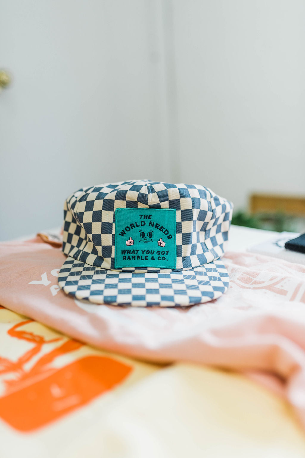 the world needs | slate + white checkered hat