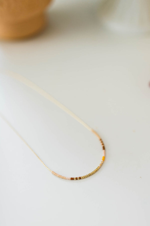 thin beaded necklace | sand