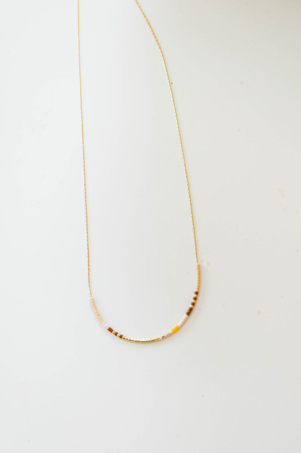 thin beaded necklace | sand