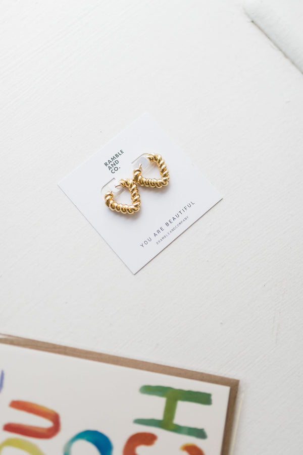 twisted heart hoop earring | 18k gold