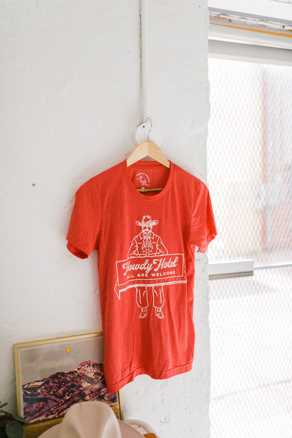 howdy hotel heather red | adult tee