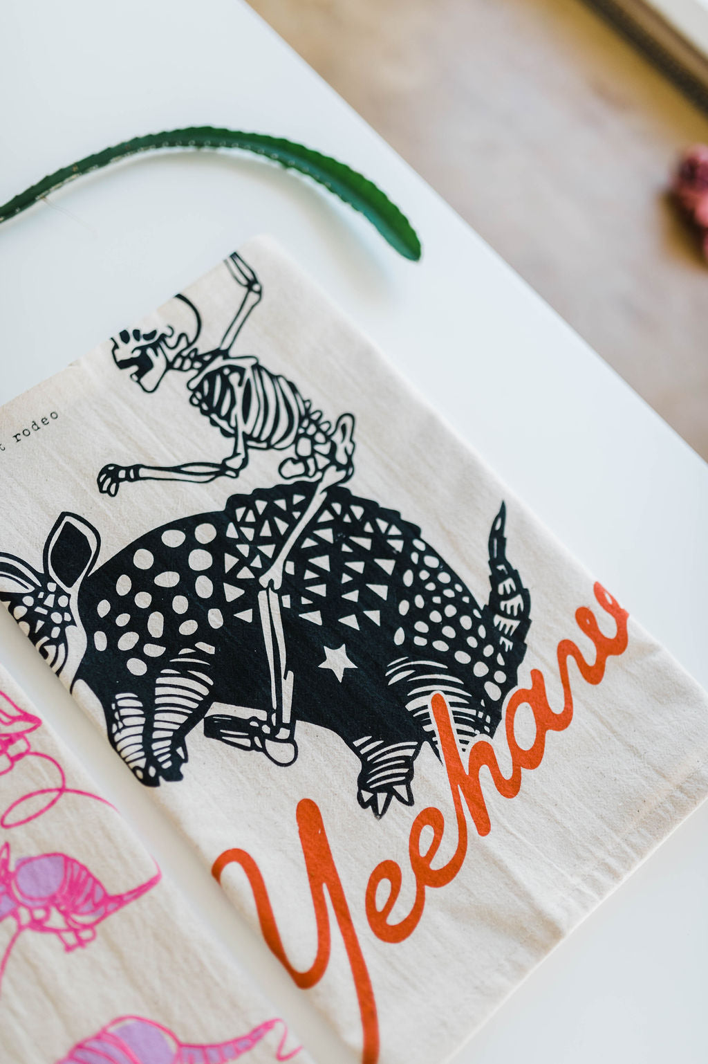 yeehaw skeleton + armadillo | tea towel