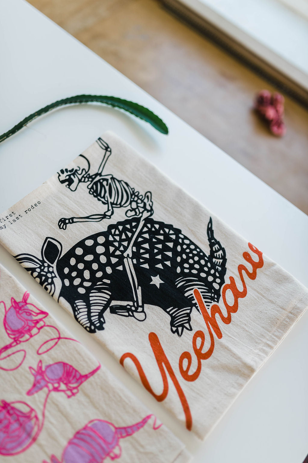yeehaw skeleton + armadillo | tea towel