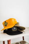 howdy hotel | yellow nylon field trip trucker hat