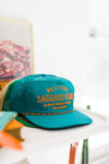 texas saguaro club | teal + orange hat
