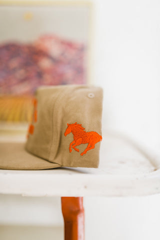 fast horse | tan + orange hat