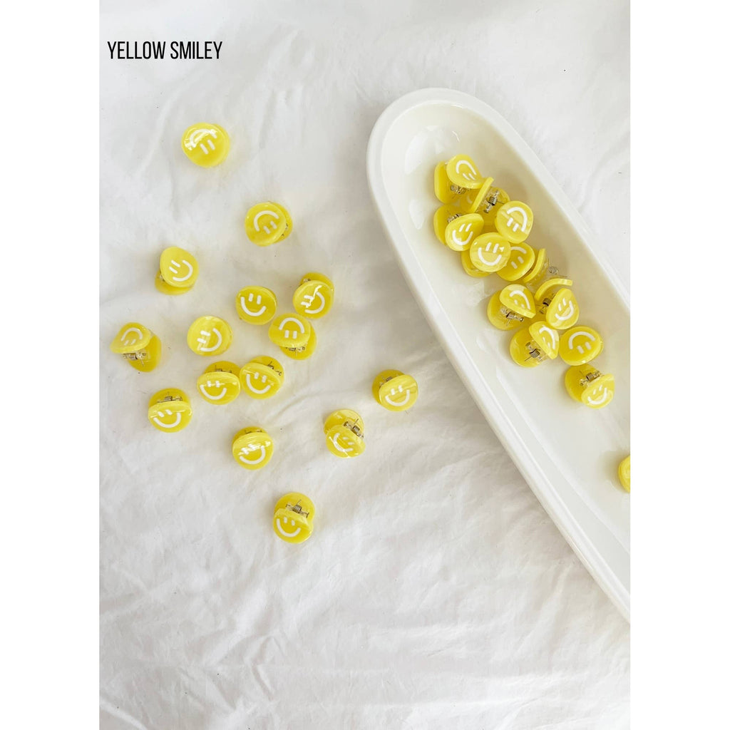 small claw clip | yellow smiley