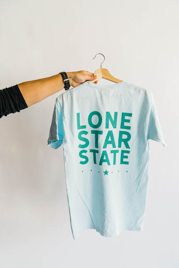 design: ﻿TX front left and LONE STAR STATE back color: light blue + sea foam ink. 100% ringspun cotton garment dyed may shrink slightly after wash. style: Classic unisex style, runs true to size. This a thicker old school, unisex tee. The perfect summer go-to. Kathryn is 5&#39;4 wearing a medium. Ramble &amp; Co. is a family owned business. Shop at shop.rambleandcompany.com or visit our store in Wichita Falls, Texas || small batch/ hand printed tees + fine art prints | your source of encouragement + inspiration.