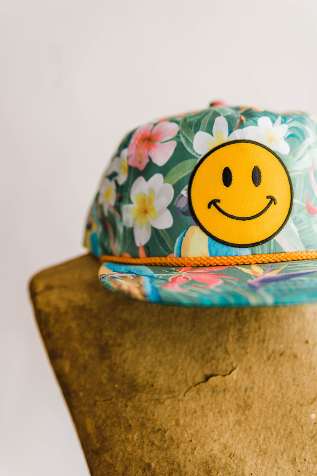 the design: the world needs what you got + ramble & co.  the color: rainforest pattern hat teal "the world needs what you got" patch  about the hat:  100% cotton twill Five panels Low profile pro-style crown Fused buckram-backed front panel Matching sewn eyelets  Plastic snap size adjuster