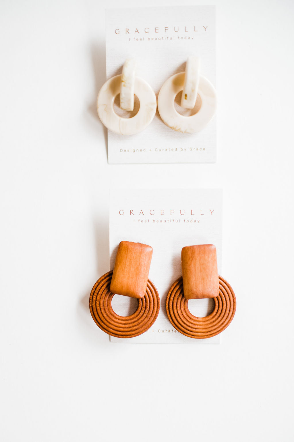 Warm wood colored earrings made out of wood. Handmade in Texas and lightweight with dimensions of 5.5cm by 3.9cm. Eye catching neutral colored earrings that will have everyone asking you where you got them! Ramble & Co. is a family owned business. Shop at shop.rambleandcompany.com or visit our store in Wichita Falls, Texas || small batch/ hand printed tees + fine art prints | your source of encouragement + inspiration.