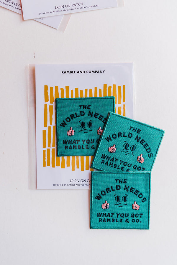 the design: the world needs what you got  the color: teal, black, and blush  approx. 2.5&quot; x 2.5&quot;  To apply:  Each patch is woven with an iron on backing. Hand stitching the patch around the edge will double ensure the longevity of the patch placement. Ramble &amp; Co. is a family owned business. Shop at shop.rambleandcompany.com or visit our store in Wichita Falls, Texas || small batch/ hand printed tees + fine art prints | your source of encouragement + inspiration.