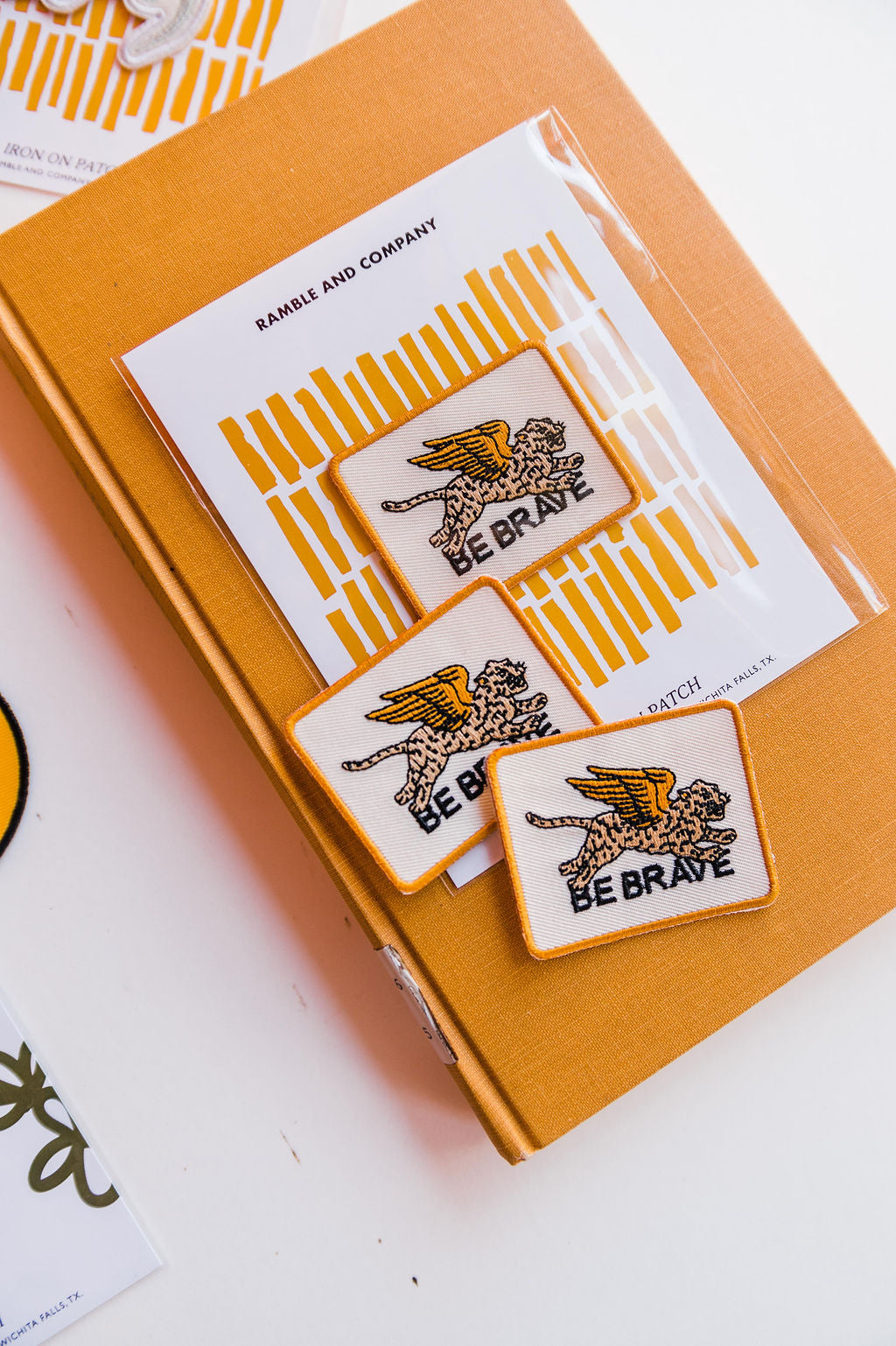So many possibilities + ways to use these one-of-a-kind Ramble & Co. patches. the design: be brave the color: cream and black background  aprox. 2" x 2.5" To apply: Each patch is woven with an iron on backing.   Ramble & Co. is a family owned business. Shop at shop.rambleandcompany.com or visit our store in Wichita Falls, Texas || small batch/ hand printed tees + fine art prints | your source of encouragement + inspiration.
