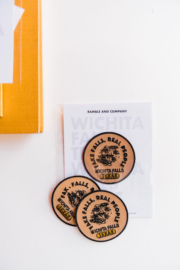  So many possibilities + ways to use these Ramble &amp; Co. patches. the design: fake falls, real people. tan, black, and gold  approx. 2.5&quot; x 2.5&quot;  To apply:  Each patch is woven with an iron on backing. Ramble &amp; Co. is a family owned business. Shop at shop.rambleandcompany.com or visit our store in Wichita Falls, Texas || small batch/ hand printed tees + fine art prints | your source of encouragement + inspiration.