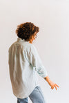 the color: white and blue tint stripes Our Button Up: 100% cotton fabric in our custom stripe. Color ways: puffin's bill and blue tint! Designed to fit like your favorite mens vintage shirt, but with a more feminine take. 100% cotton | one chest pocket sizing: ﻿runs true to size. Ramble & Co. is a family owned business. Shop at shop.rambleandcompany.com or visit our store in Wichita Falls, Texas || small batch/ hand printed tees + fine art prints | your source of encouragement + inspiration.