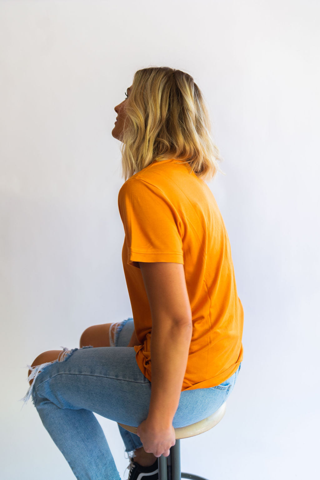 the “fancier” version of a t-shirt. the design: blank for all of our ladies who love a good basic tee! color: apricot buff tee. the material:100% viscose with a boxy, slouchy fit. the sleeves are wide with a ringer style neckline. HIGH CHANCE OF SHRINKAGE! Wash on cold and then hang dry! It will shrink in length in the dryer. Ramble & Co. is a family lifestyle brand creating simple, timeless, quality apparel. Each piece is handprinted in our brick and mortar studio located in Wichita Falls, Texas.  