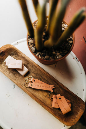 the design: good times ahead. the material: leather. hand stamped by lost penguin leather. made in texas. key fobs are fun but leather key fobs are the most fun.Ramble & Co. is a family owned business. Shop at shop.rambleandcompany.com or visit our store in Wichita Falls, Texas || small batch/ hand printed tees + fine art prints | your source of encouragement + inspiration.