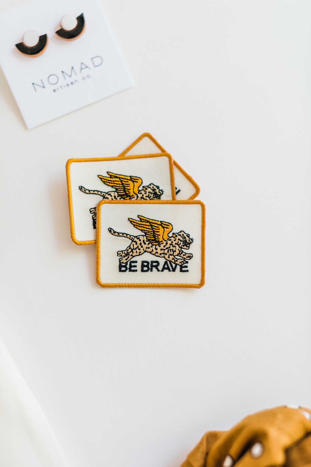 So many possibilities + ways to use these one-of-a-kind Ramble & Co. patches. the design: be brave the color: cream and black background  aprox. 2" x 2.5" To apply: Each patch is woven with an iron on backing.   Ramble & Co. is a family owned business. Shop at shop.rambleandcompany.com or visit our store in Wichita Falls, Texas || small batch/ hand printed tees + fine art prints | your source of encouragement + inspiration.