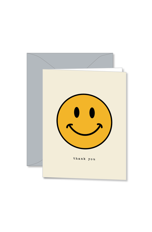 Cream notecard with yellow smiley design and thank you text design by Ramble and Co. | you can shop now at  shop.rambleandcompany.com or visit our storefront in downtown Wichita Falls, Texas || small batch + hand printed tees | home goods | paper goods | gifts + more