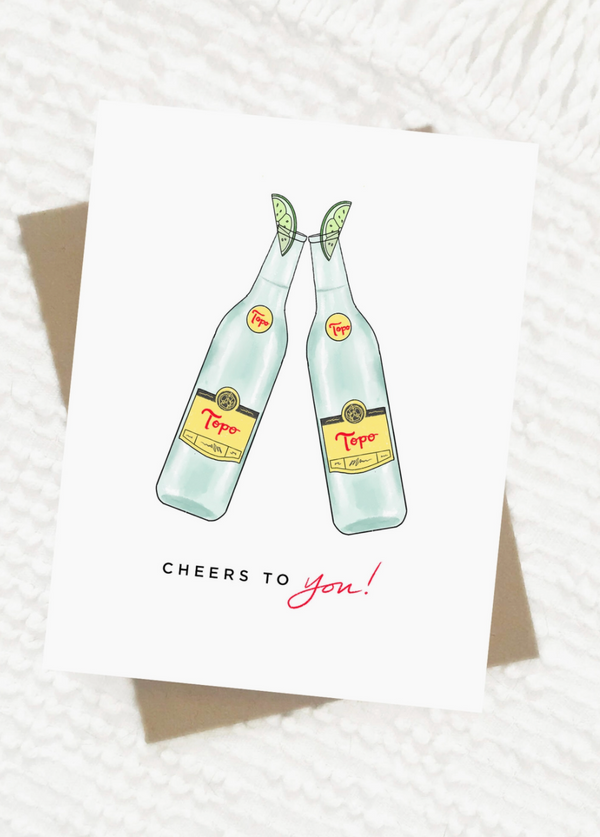 the design: topo cheers to you. the size: a2 | 4.25 by 5.5 inches folded. packed in a cello sleeve with corresponding envelope, blank inside, made in the USA. topo is so yum that we had to make a card! now, lets celebrate. Ramble & Co. is a family owned business. Shop at shop.rambleandcompany.com or visit our store in Wichita Falls, Texas || small batch/ hand printed tees + fine art prints | your source of encouragement + inspiration.