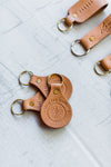 the design: trust the journey. the material: leather. hand stamped by lost penguin leather, made in texas. key fobs are fun but leather key fobs are the most fun. Ramble & Co. is a family owned business. Shop at shop.rambleandcompany.com or visit our store in Wichita Falls, Texas || small batch/ hand printed tees + fine art prints | your source of encouragement + inspiration.